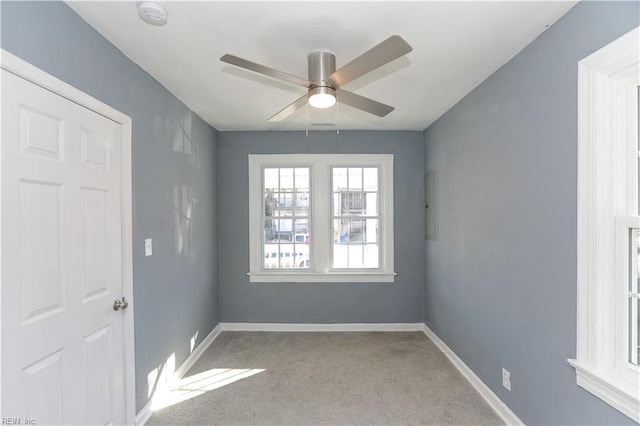 empty room with light carpet and ceiling fan