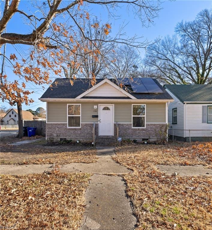 view of front of property with solar panels