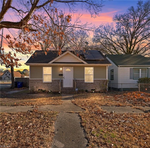 view of front of house with solar panels