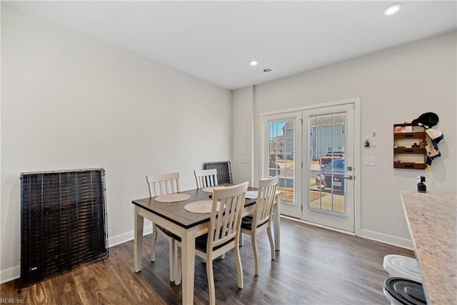 dining room with dark hardwood / wood-style floors