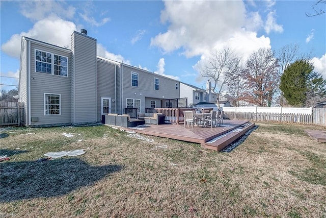 rear view of house featuring a wooden deck, an outdoor living space, and a yard