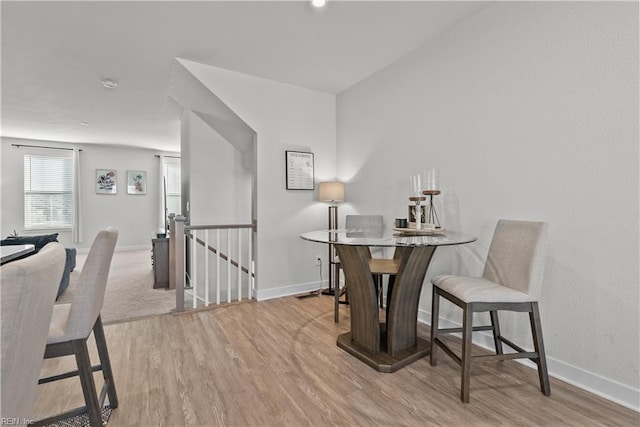 dining space with light wood-type flooring