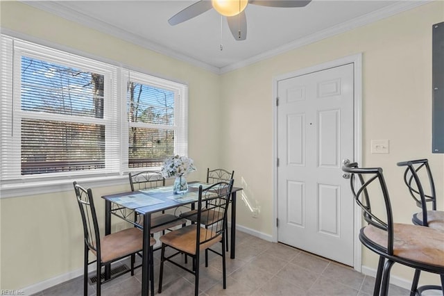 dining room featuring ceiling fan, crown molding, and light tile patterned floors