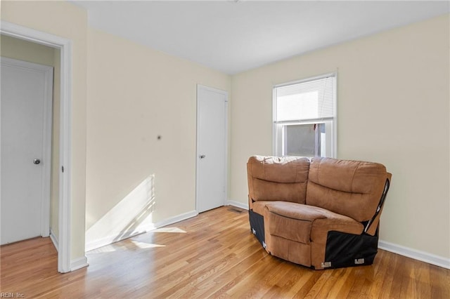 living area featuring light hardwood / wood-style floors