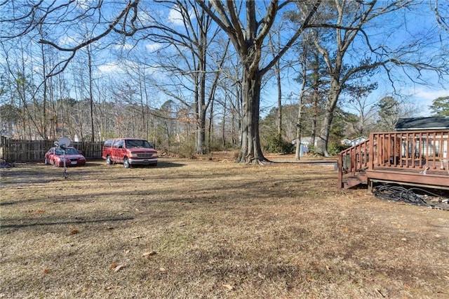 view of yard featuring a wooden deck