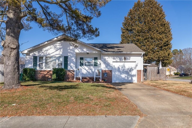 ranch-style house featuring a garage and a front lawn