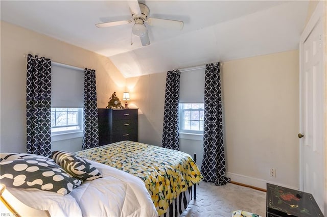 bedroom with multiple windows, ceiling fan, and vaulted ceiling