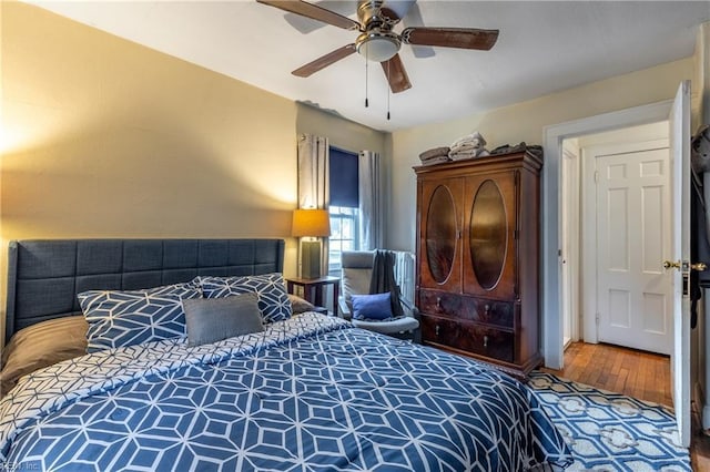 bedroom featuring ceiling fan and hardwood / wood-style flooring