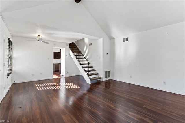 unfurnished living room featuring ceiling fan, dark hardwood / wood-style flooring, and lofted ceiling with beams