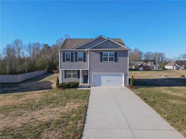 view of front of property with a garage and a front lawn