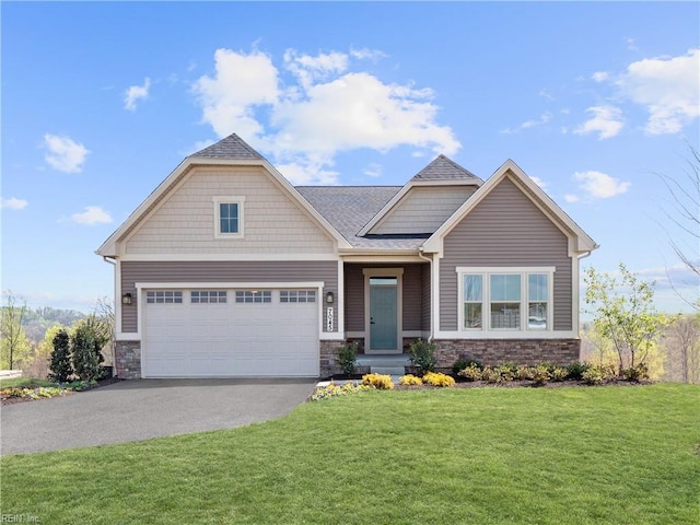 craftsman inspired home featuring a front yard and a garage