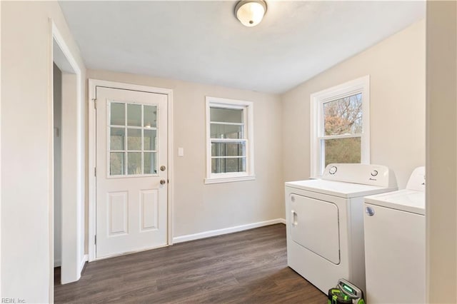 clothes washing area with washing machine and dryer and dark hardwood / wood-style floors