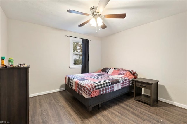 bedroom featuring ceiling fan and dark wood-type flooring