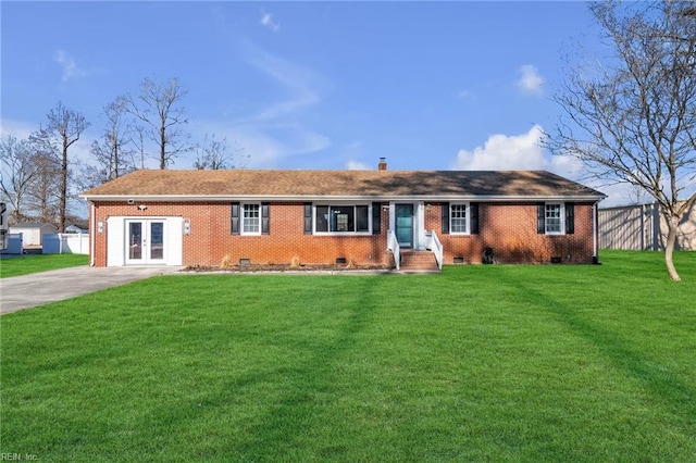 single story home featuring french doors and a front lawn