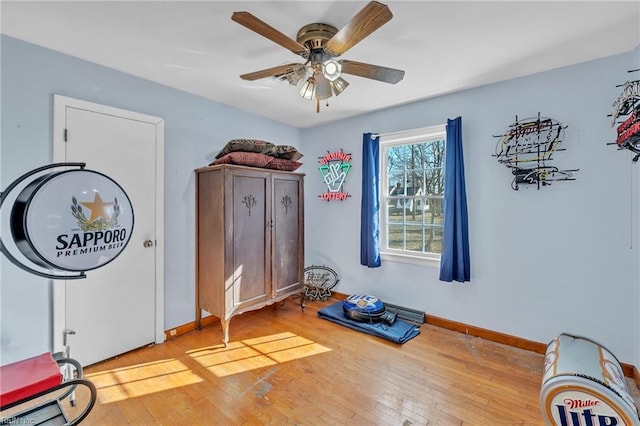 interior space featuring ceiling fan and wood-type flooring