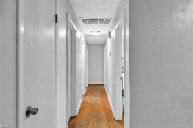 corridor featuring light hardwood / wood-style floors