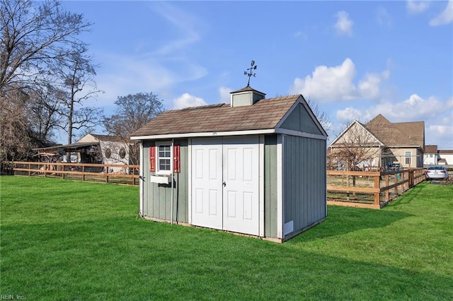 view of outbuilding featuring a yard