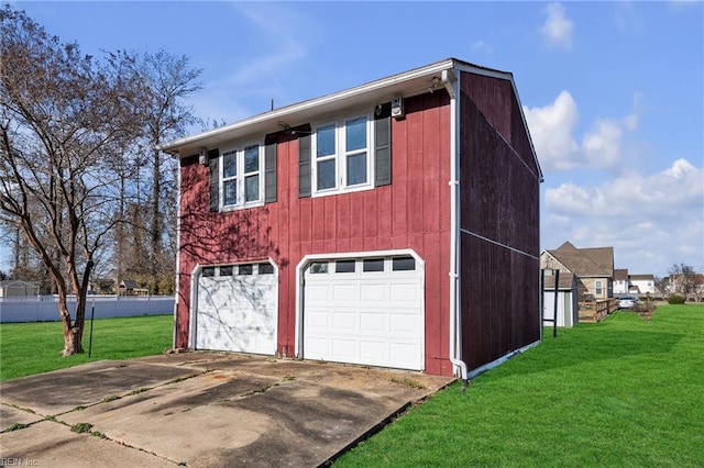 view of side of home featuring a lawn and a garage