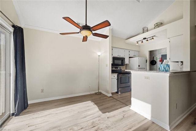 kitchen featuring light wood-type flooring, white refrigerator, ceiling fan, and stainless steel range with electric cooktop