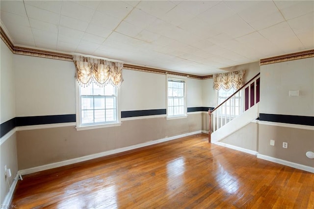 spare room with wood-type flooring