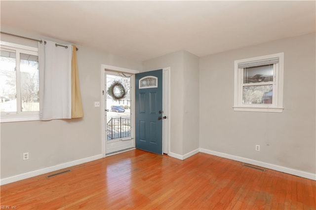 foyer entrance with hardwood / wood-style flooring