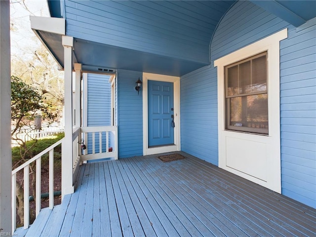 wooden terrace featuring covered porch