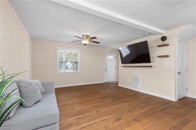 living room with wood-type flooring and ceiling fan