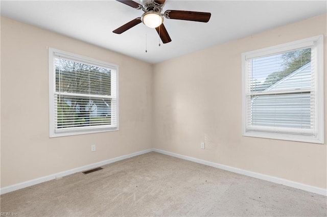 carpeted empty room with ceiling fan