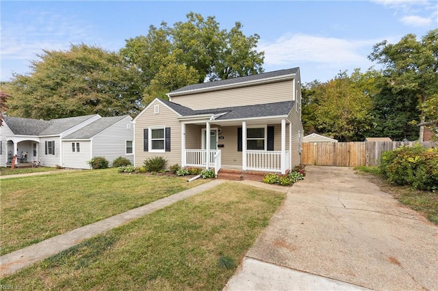 view of front of property featuring covered porch and a front yard