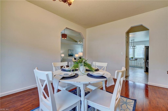 dining space featuring dark hardwood / wood-style flooring and ceiling fan