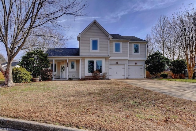 view of property with a front yard and a garage