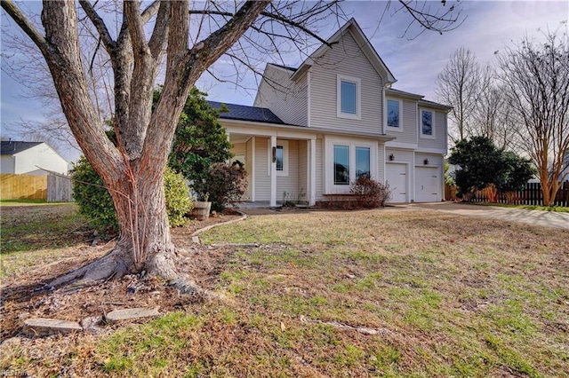 view of front facade with a garage and a front yard