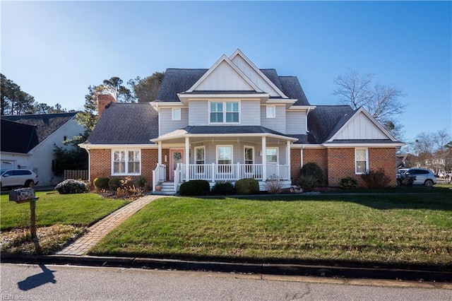 view of front of house featuring a front lawn and covered porch