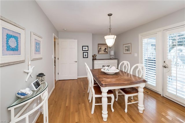 dining space featuring light hardwood / wood-style floors