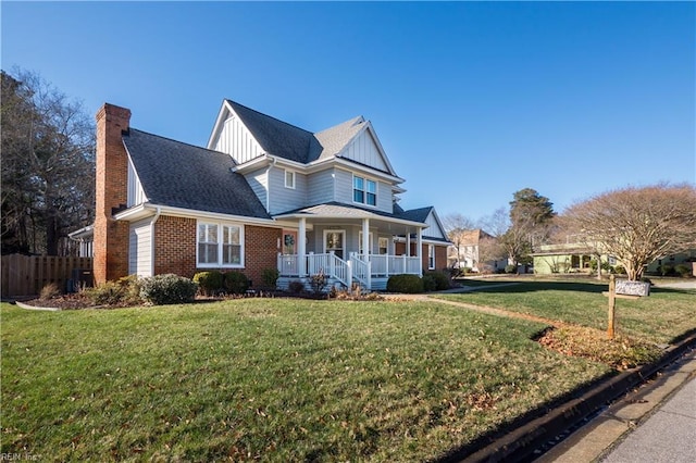 view of front of house with a front lawn and covered porch