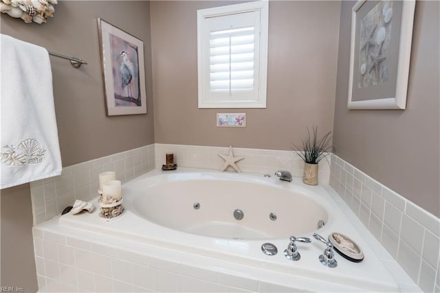 bathroom with tiled bath