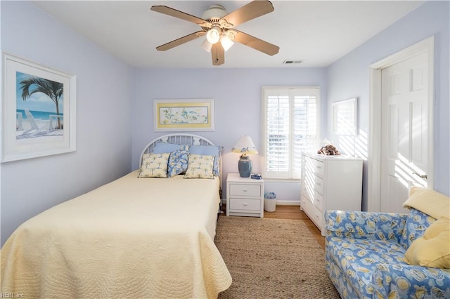 bedroom featuring light wood-type flooring and ceiling fan