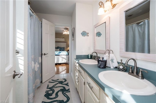 bathroom featuring tile patterned floors, ceiling fan, and vanity