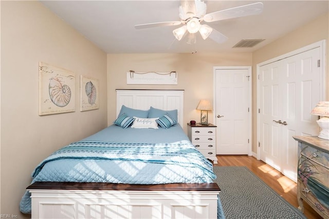 bedroom with ceiling fan and light hardwood / wood-style flooring