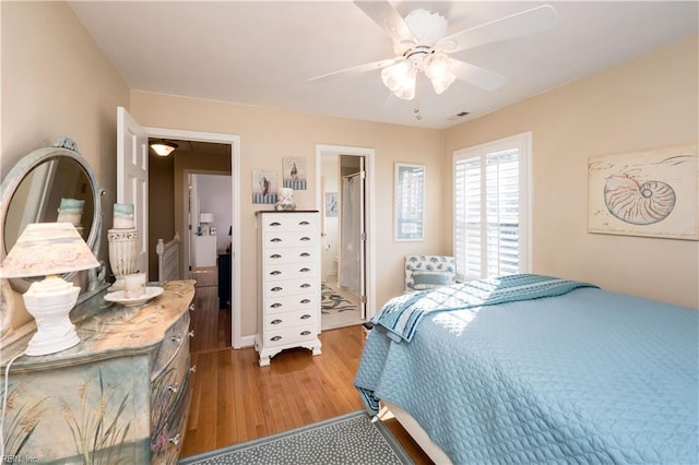 bedroom with hardwood / wood-style flooring and ceiling fan