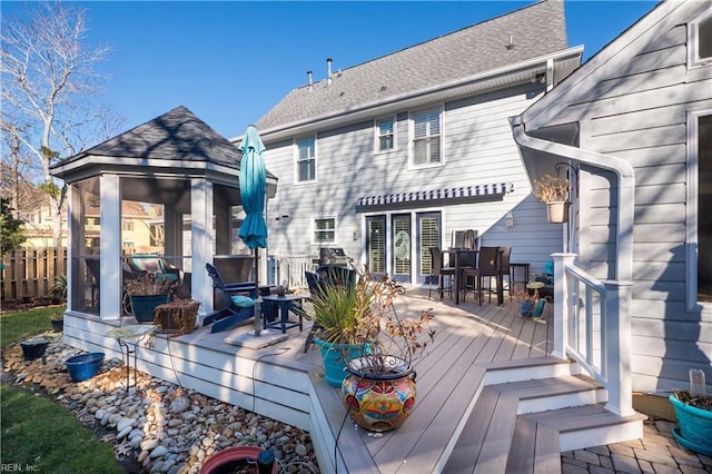 rear view of property with a deck