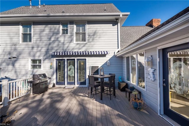 wooden deck featuring grilling area