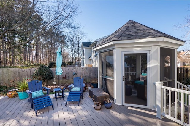 deck with a sunroom