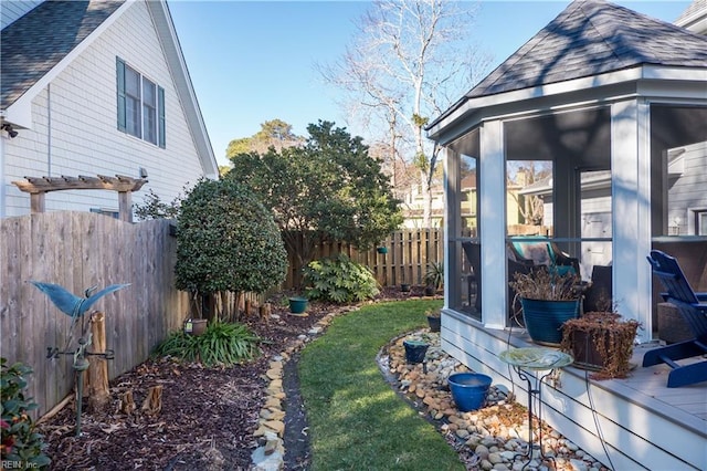 view of yard featuring a sunroom