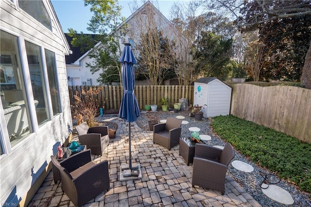 view of patio / terrace featuring an outdoor living space and a storage unit