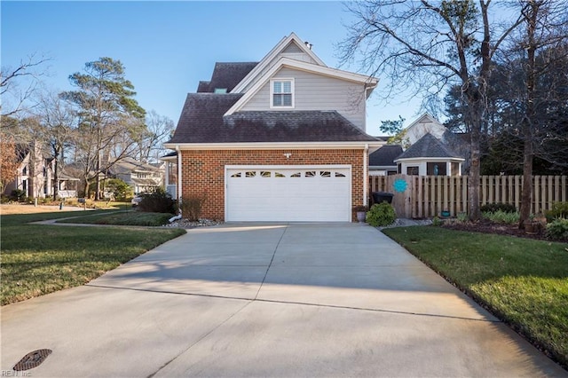 view of front facade featuring a garage and a front lawn