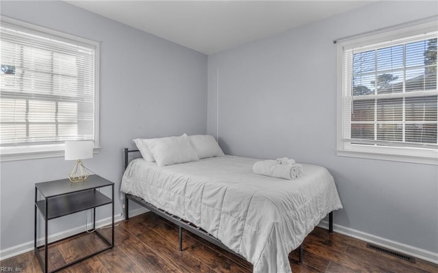 bedroom featuring dark hardwood / wood-style floors