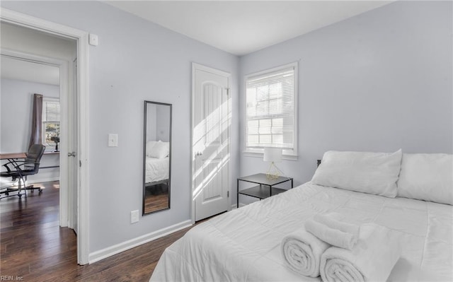 bedroom featuring dark wood-type flooring