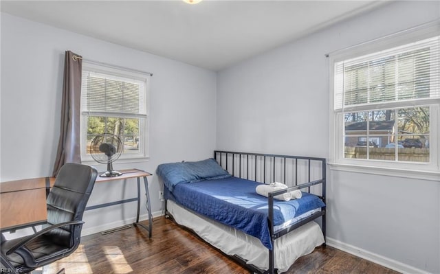 bedroom featuring dark hardwood / wood-style flooring