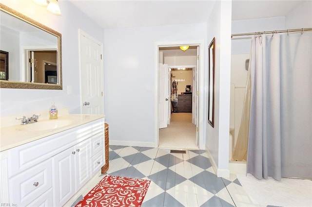 bathroom featuring vanity and walk in shower